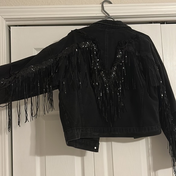 Black denim jacket with sparkle fringe along back and down sleeves. - Picture 2 of 2